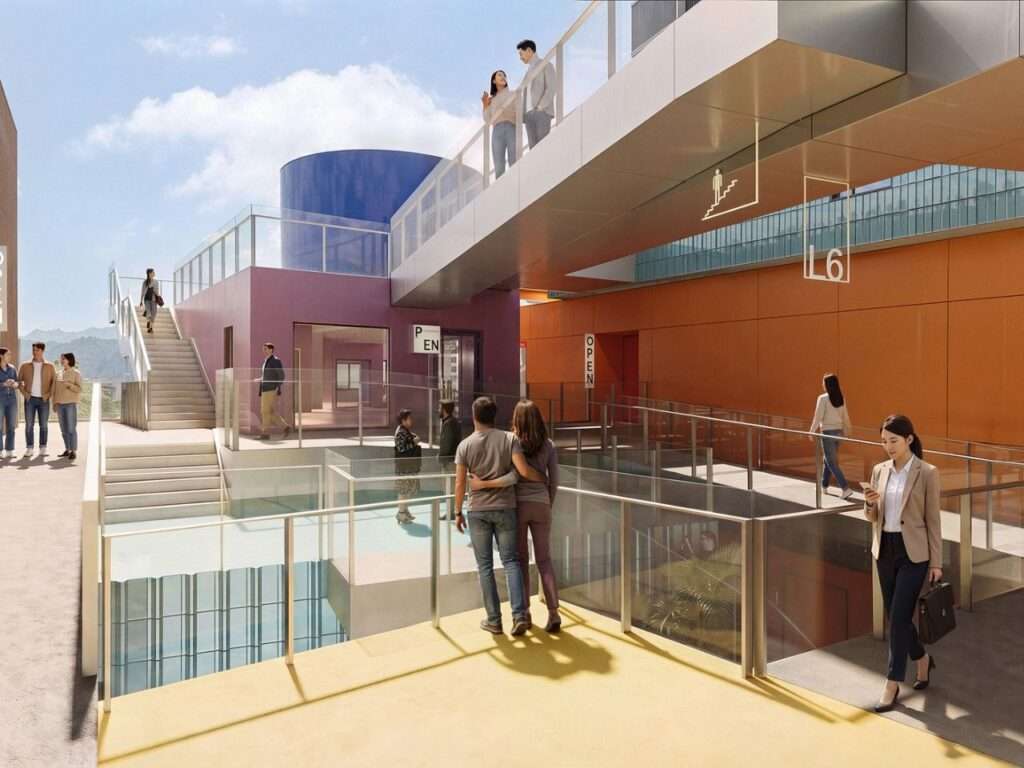 Rooftop terrace and skybridge network featuring visitors walking between colorful upper-level structures at Bihailou Art Village.