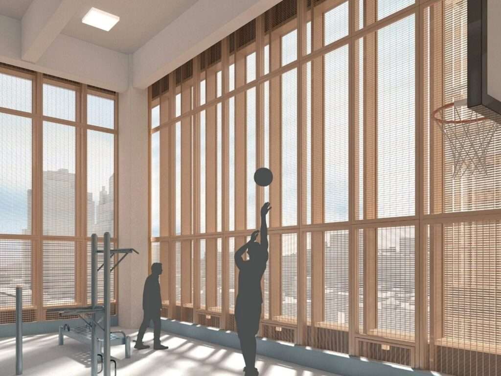 Interior recreational court in the Manhattan Detention Center featuring double-skin screened windows and natural daylighting.