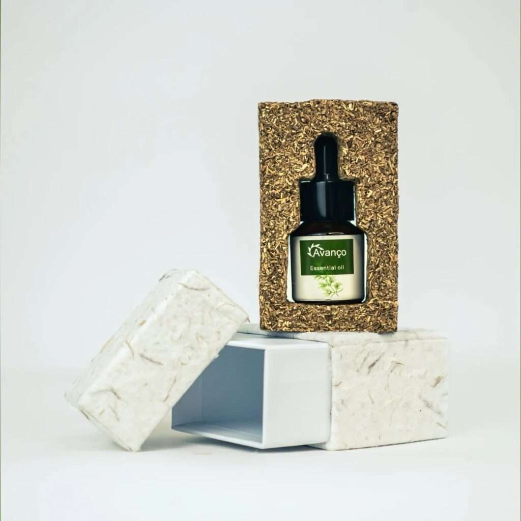 The complete Scentra packaging set featuring the textured fiber block insert resting atop the open textured white sliding box.