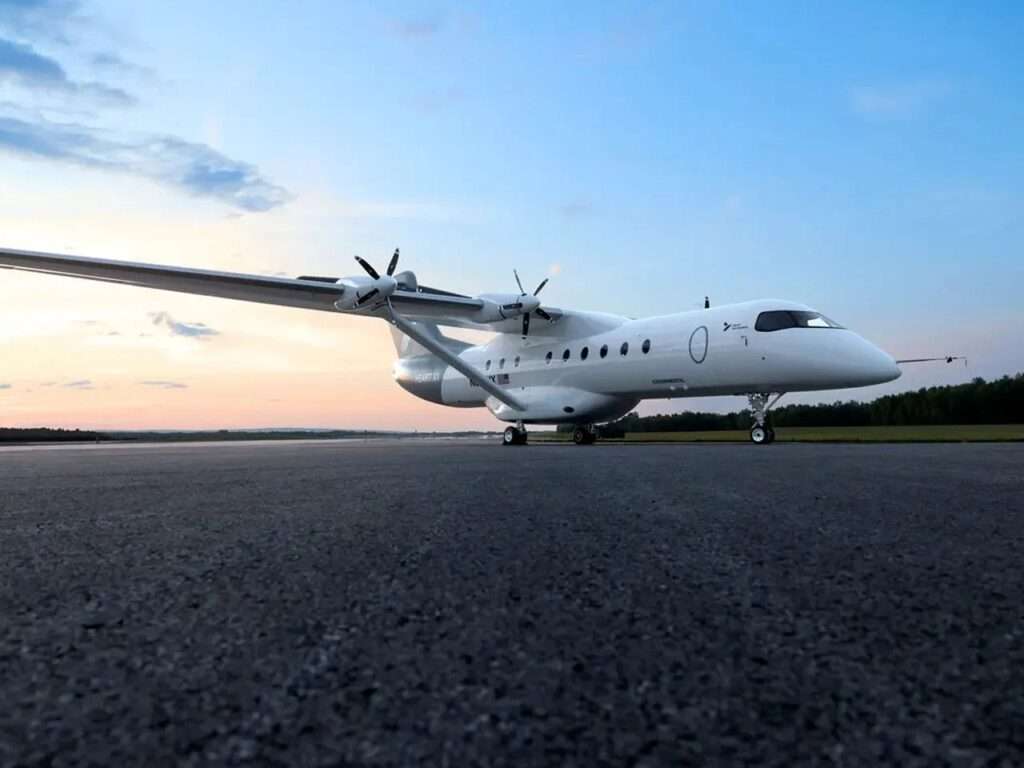 Wide low-angle front perspective of the Heart X1 aircraft parked on the runway at twilight.
