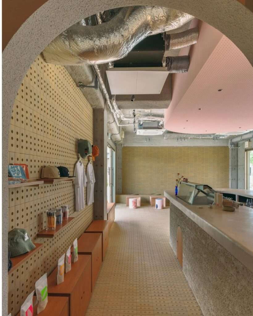 Framed view through an archway showing the retail wall, tile flooring, and main service area of SR Ice Cream.