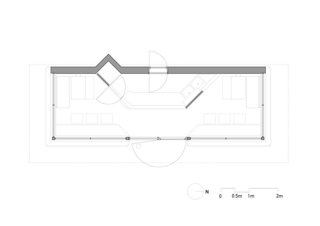Architectural floor plan drawing of Cafe N+ showing interior layout, central service bar, entrance, window seating, and wall thickness.