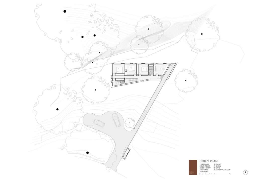 A detailed entry-level architectural floor plan drawing of EA House, showing the access bridge, minimal construction footprint, and the surrounding cliff topography with existing trees.