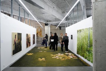 A contemporary art exhibition bringing together diverse artistic expressions, innovative installations, and thought-provoking works within a modern gallery environment.