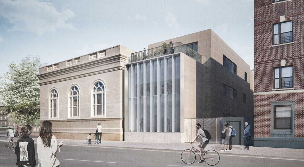 Street-level perspective showing the historic library exterior next to a new modern three-story wing