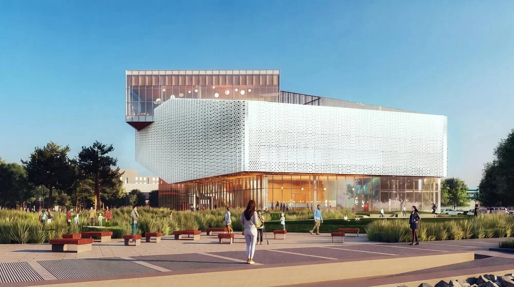 Building view with perforated screen upper levels and transparent glazed lower level facing a plaza.