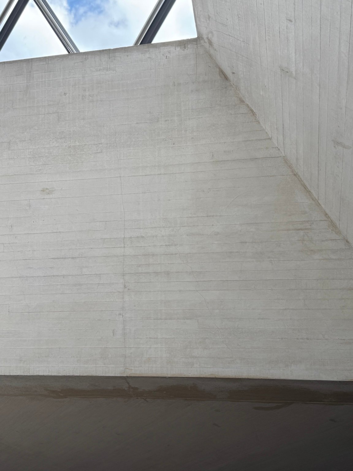 Surface marks and paint conditions inside the Louvre, observed as traces of age and use.