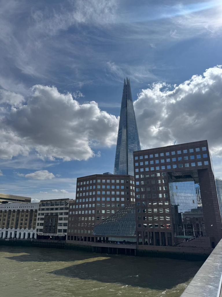 A quiet skyline behind the bridge in 2006, and the sharp Shard tower piercing the sky in 2026.