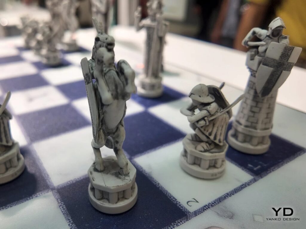 Detailed view of a stone-like knight piece rearing on its hind legs alongside pawn figures on a chessboard.