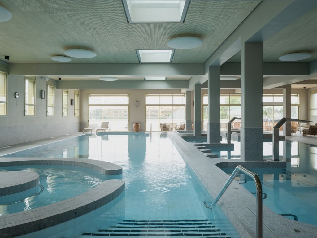 Perspective view of hydrotherapy pools and open structural layout in Donnan Health Center.