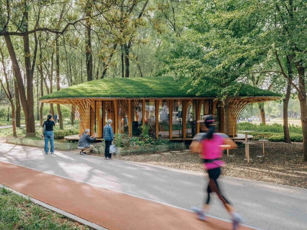 Runner passing by the West Garden Florist pavilion set along a running track in Haidian Park.