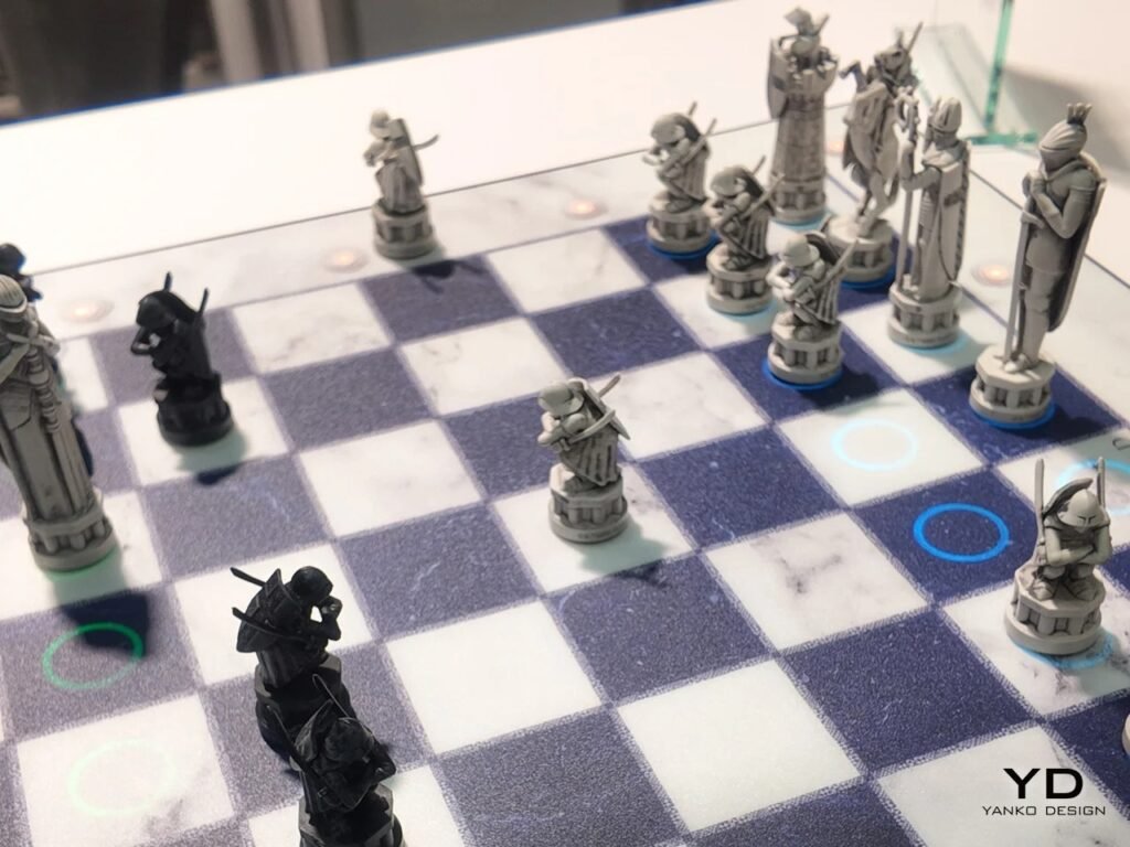 Perspective shot of a automated chess move in progress on an illuminated marble playing surface.