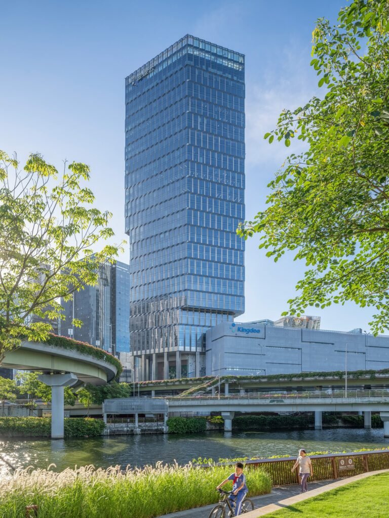 Kingdee HQ Tower seen from across the urban park and river greenway in Nanshan, Shenzhen.
