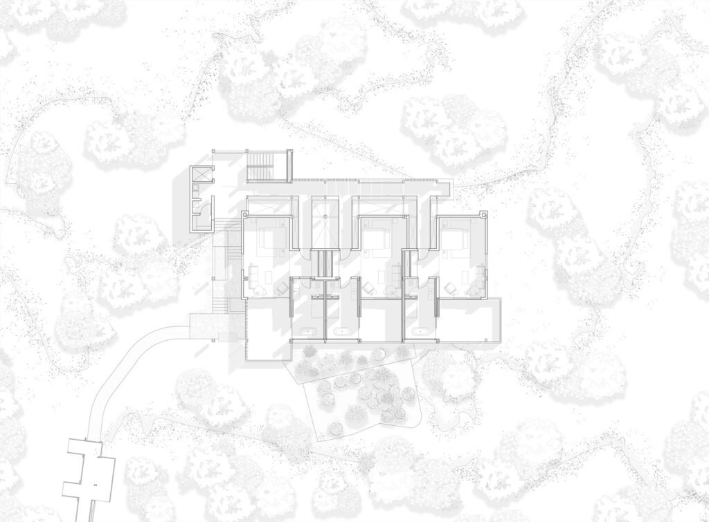 A technical black-and-white architectural site plan, showing the two-story building footprint, contours of the sloped landscape with trees, and the curated communal heart of the Finch Bay Hotel complex.
