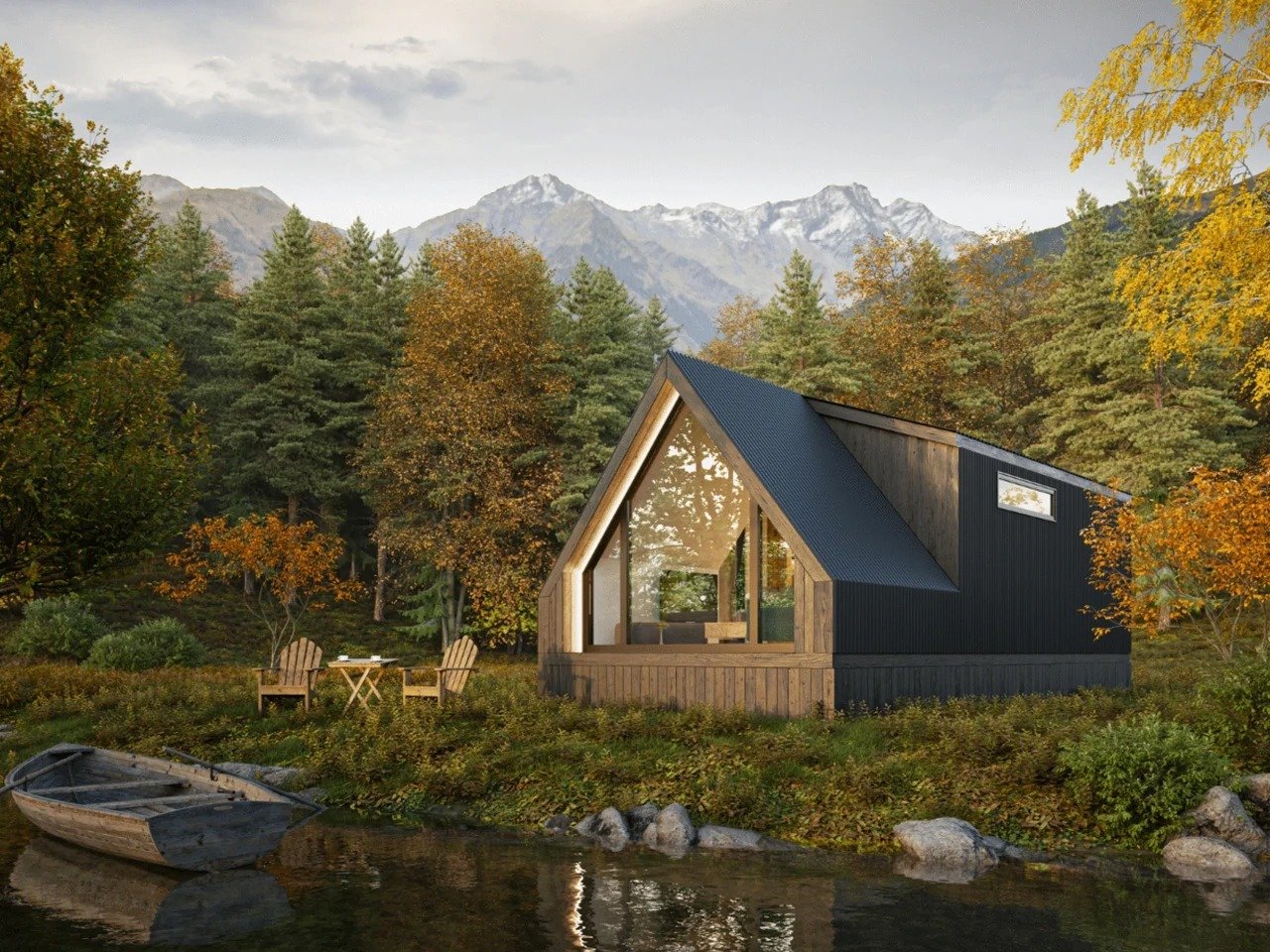 Exterior view of the A-Frame Bunkhouse by Zook Cabins featuring a dark matte metal roof, thermally treated Lunawood accents, and a full-height triangular glass wall beside a calm lake with autumn foliage.