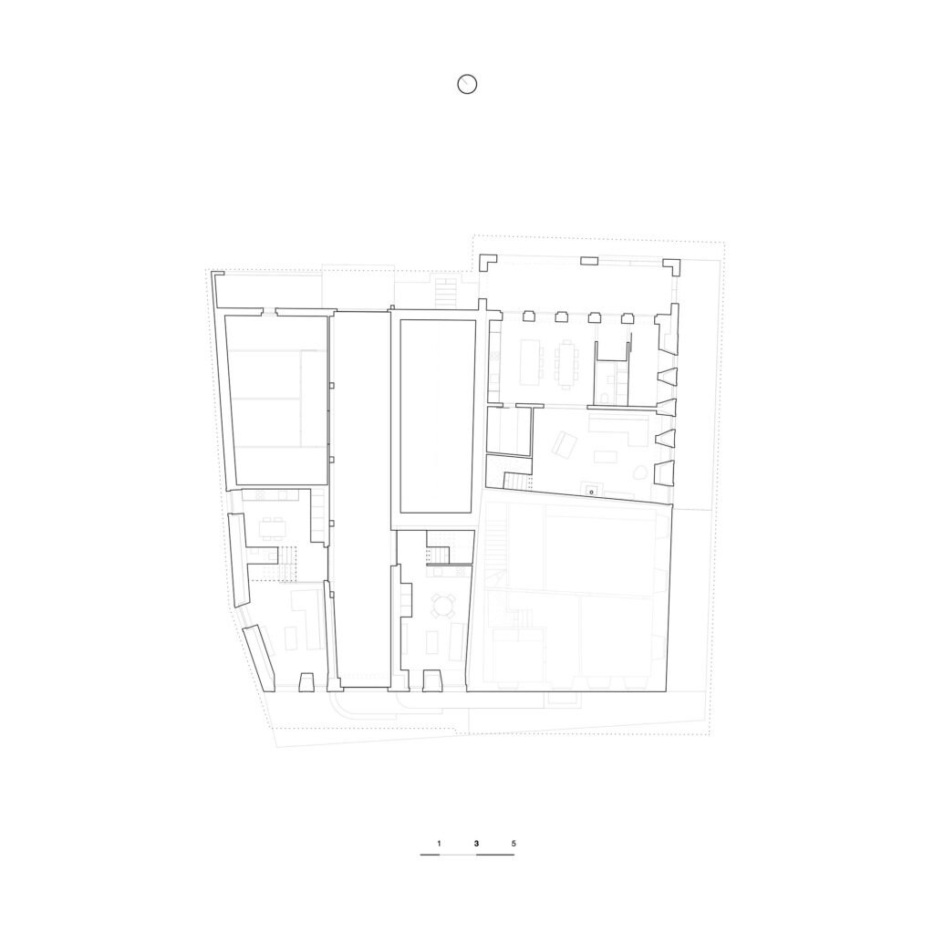 Architectural ground floor plan drawing of the Grandvillard farmhouse renovation project displaying apartment layouts, courtyard, and wall thicknesses.