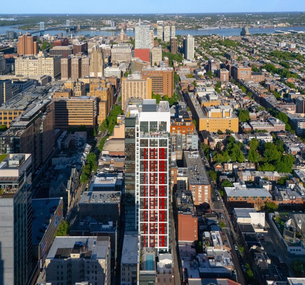 High-altitude top-down aerial photo of 210 South 12th tower looking toward the Delaware River and Philadelphia cityscape.