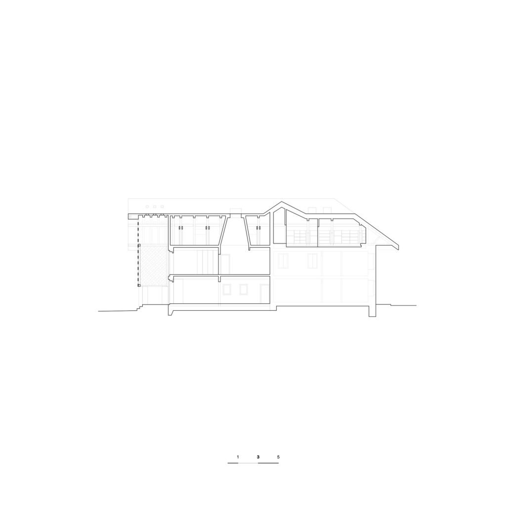 Architectural longitudinal section drawing AA of the Grandvillard farmhouse showing double-height spaces, roof structure, and floor levels.