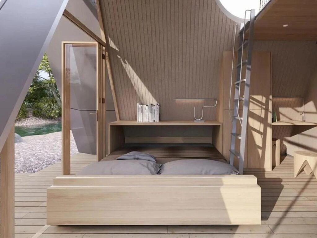 Camping House living space transformed into nighttime sleeping layout with fold-down double bed extended from the wall unit.