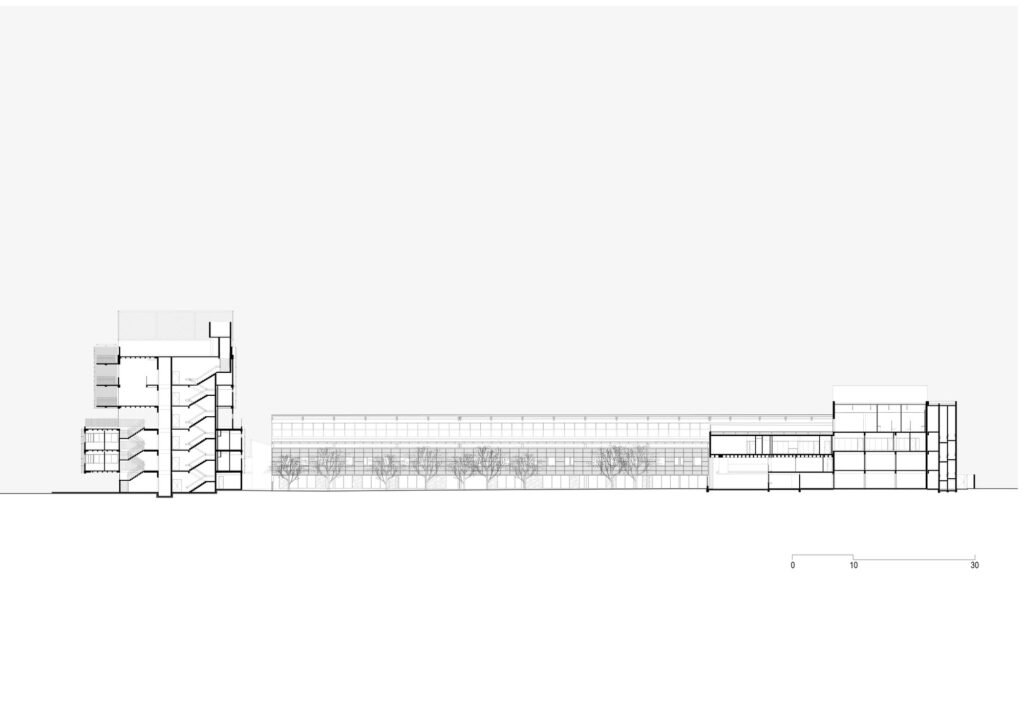 Architectural section drawing showing vertical floor levels of the new building alongside long renovated industrial warehouse.