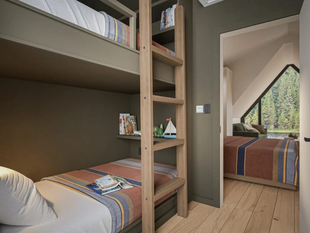 View from the dedicated bunk bed room showing built-in wooden bunk beds with a ladder, leading through an open doorway toward the main bedroom and living room window.