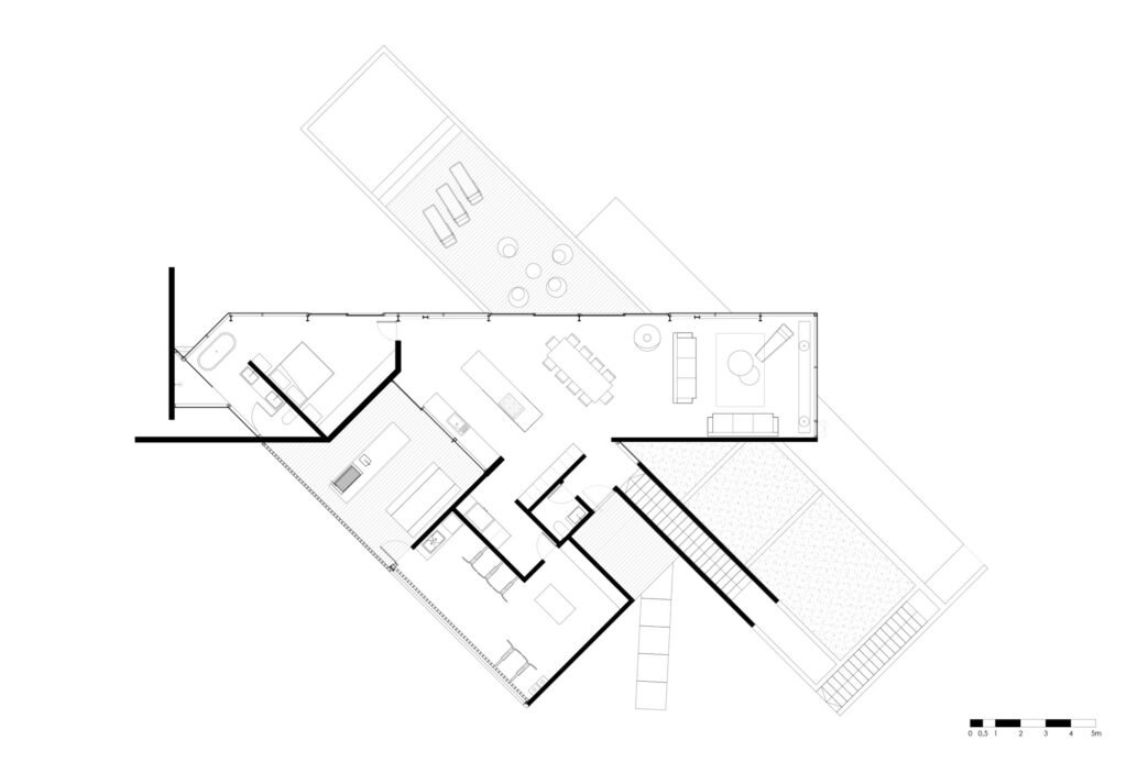 Architectural floor plan of Level 1 (upper level) of Casa 22, detailing the open-plan living, dining, kitchen layout, outdoor deck, and rotated geometry.