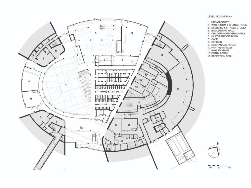 Level 1 architectural floor plan diagram of Coronation Park Sports Centre showing the urban court, fitness studios, cafe, and auxiliary spaces.