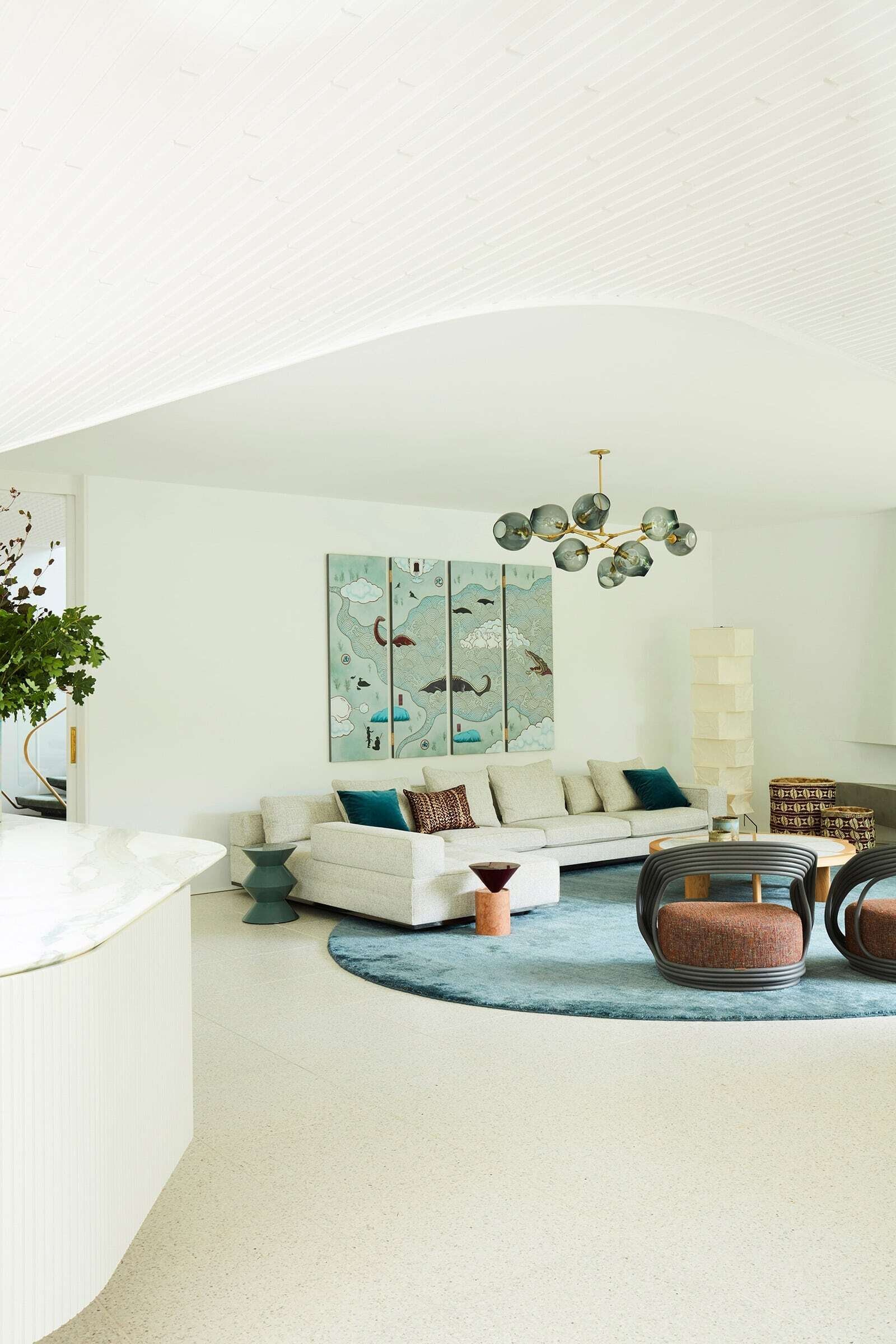 Living room with floating concrete fireplace