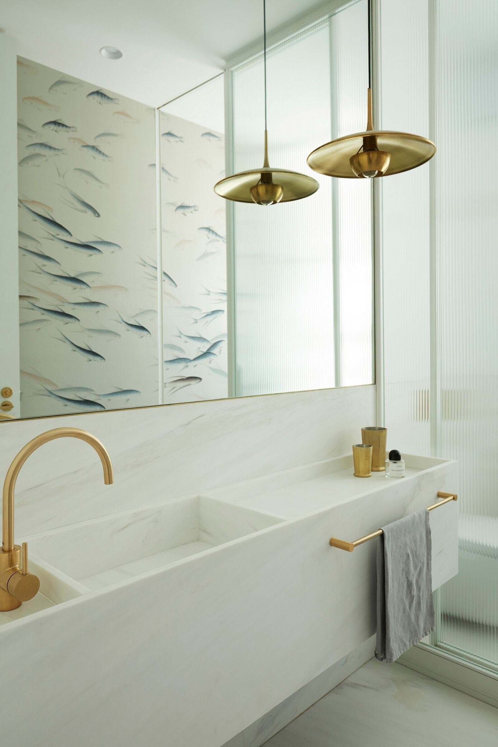 Renovated bathroom with white vanity and patterned detail
