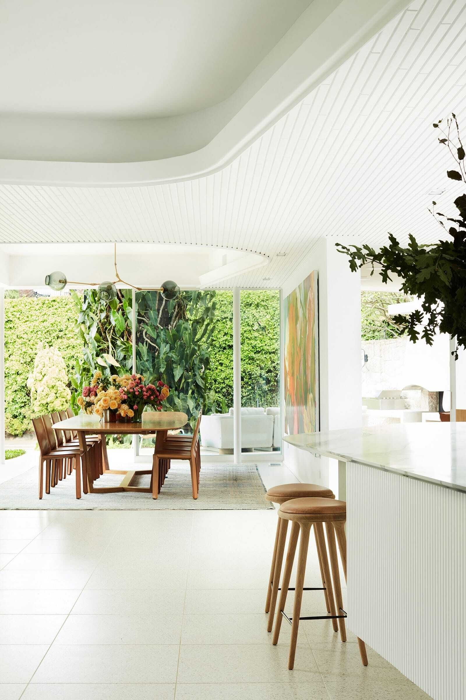 Dining area beside full-height sliding doors