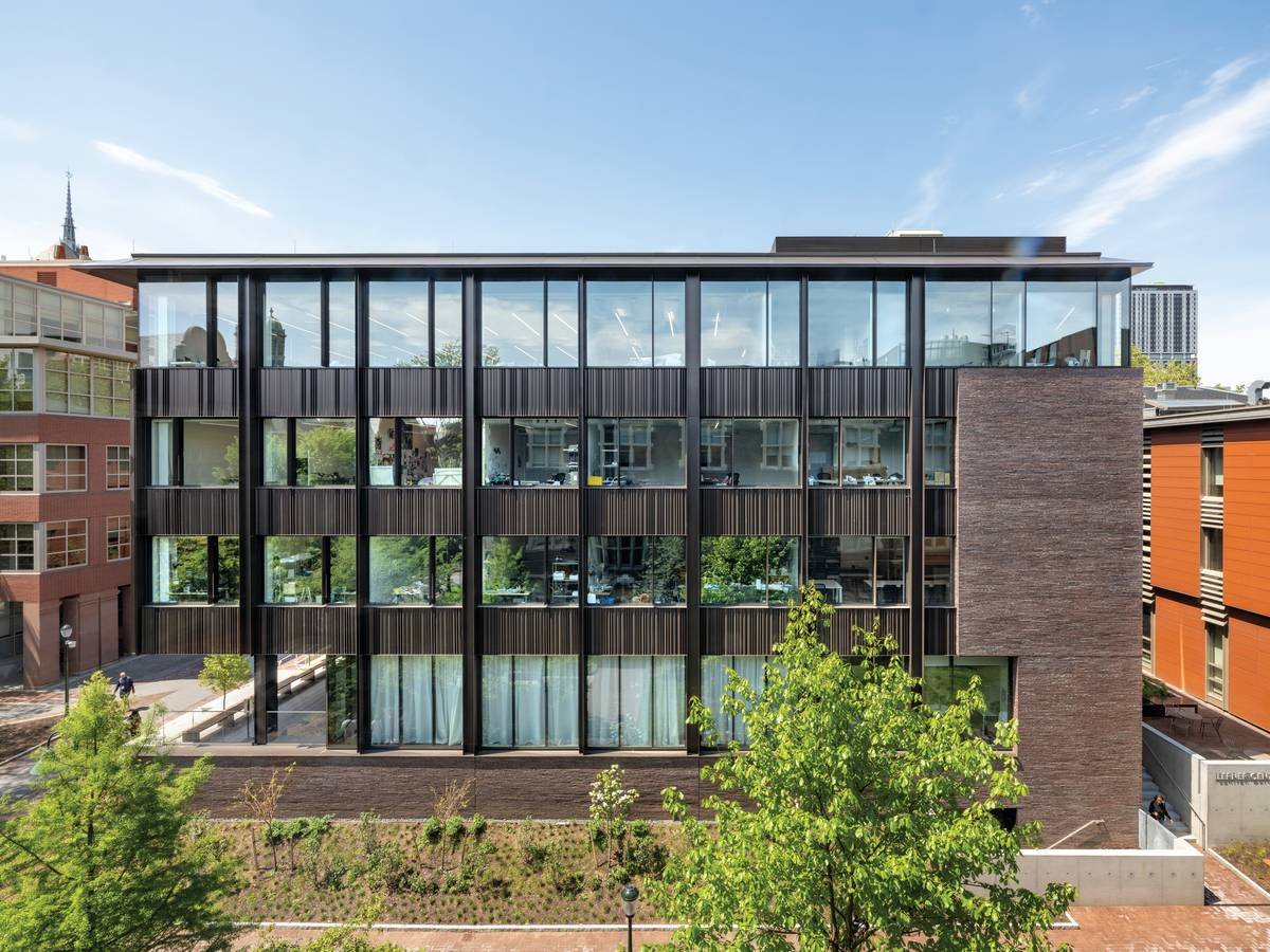 Ribbon windows and folded metal panels on the addition