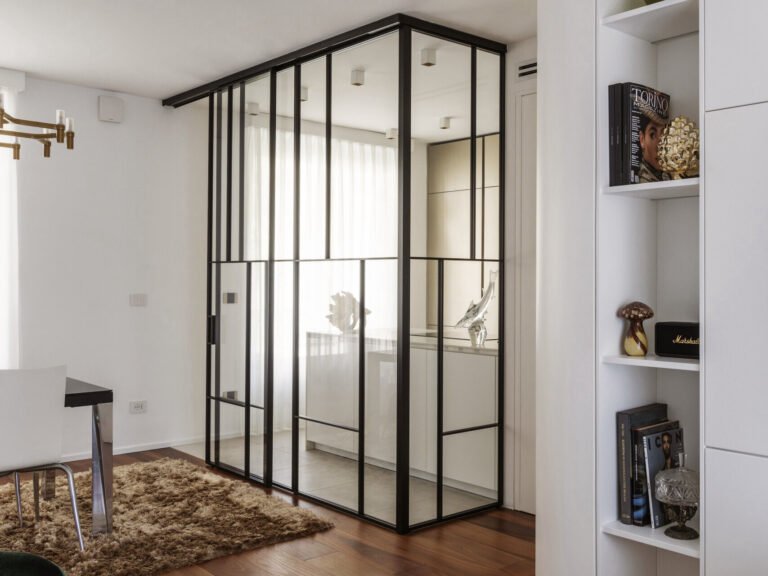 Glass-enclosed kitchen inside a Turin apartment — مطبخ محاط بالزجاج داخل شقة في تورينو