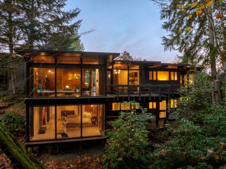 The Burrows house, with two glazed levels and timber cladding on a wooded Seattle slope