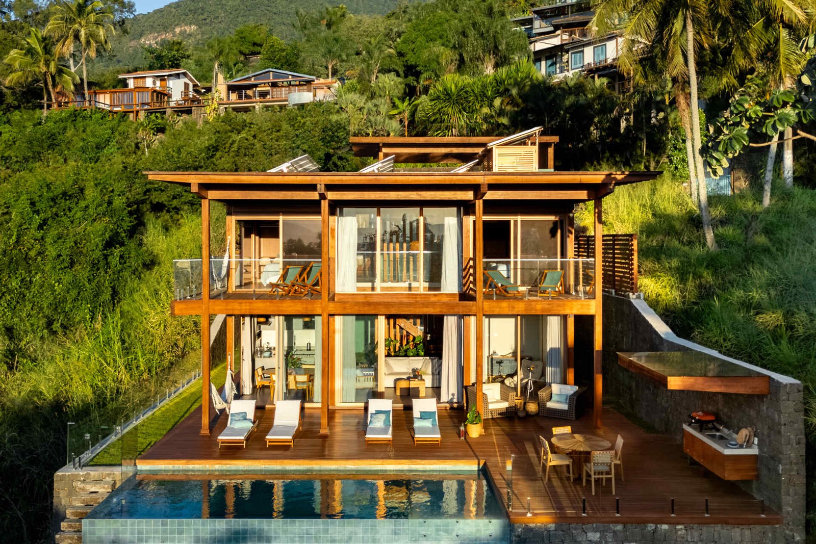 Front elevation of Casa Ponta da Sela, with timber framing above the pool.