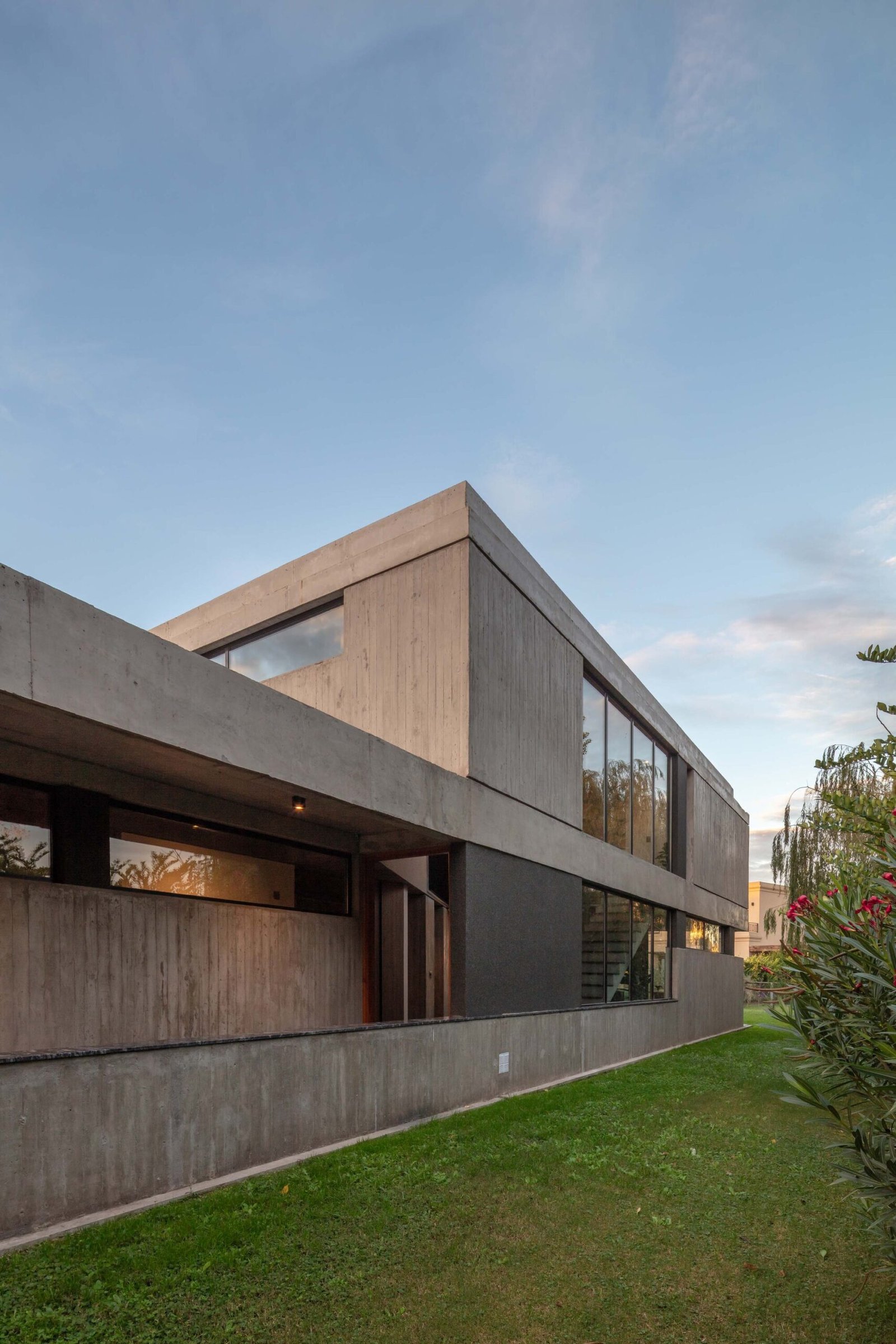 Concrete volume and recessed glazing