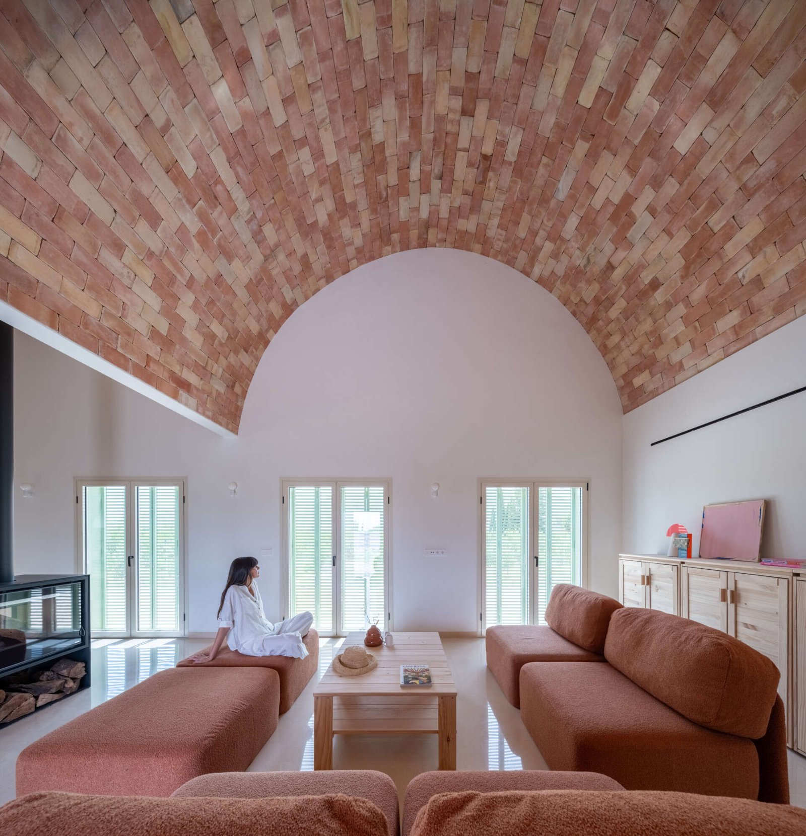 Casa Vereda living room with exposed brick vault and low seating. © David Frutos