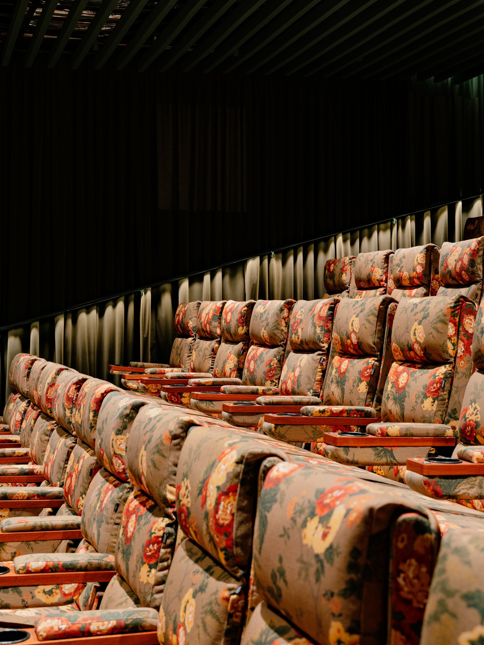 Upholstered seating against the dark curtain lining