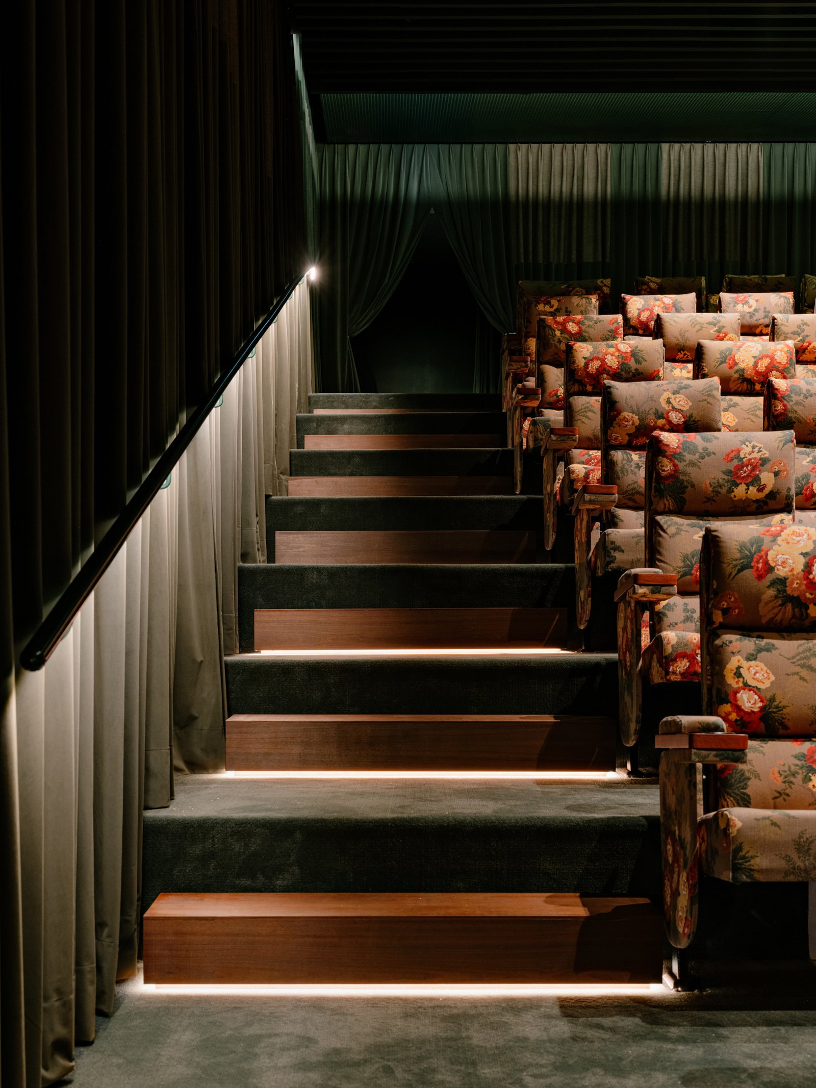 Low lighting marks the side staircase