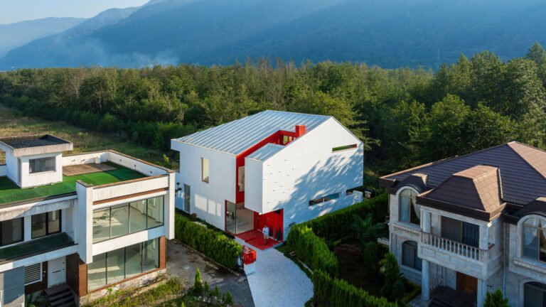 Corner Villa within the residential setting and wooded landscape.
