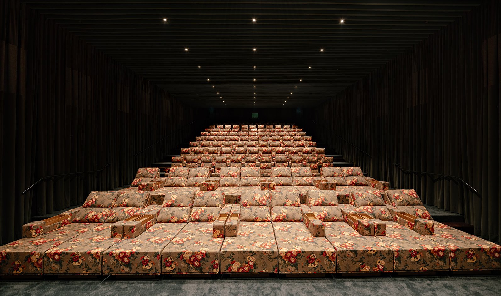 Floral seating arranged in tiers inside the screening room
