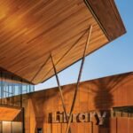 Timber-lined canopy and slender steel supports at Gateway Public Library; photograph &copy; Jason Roehner