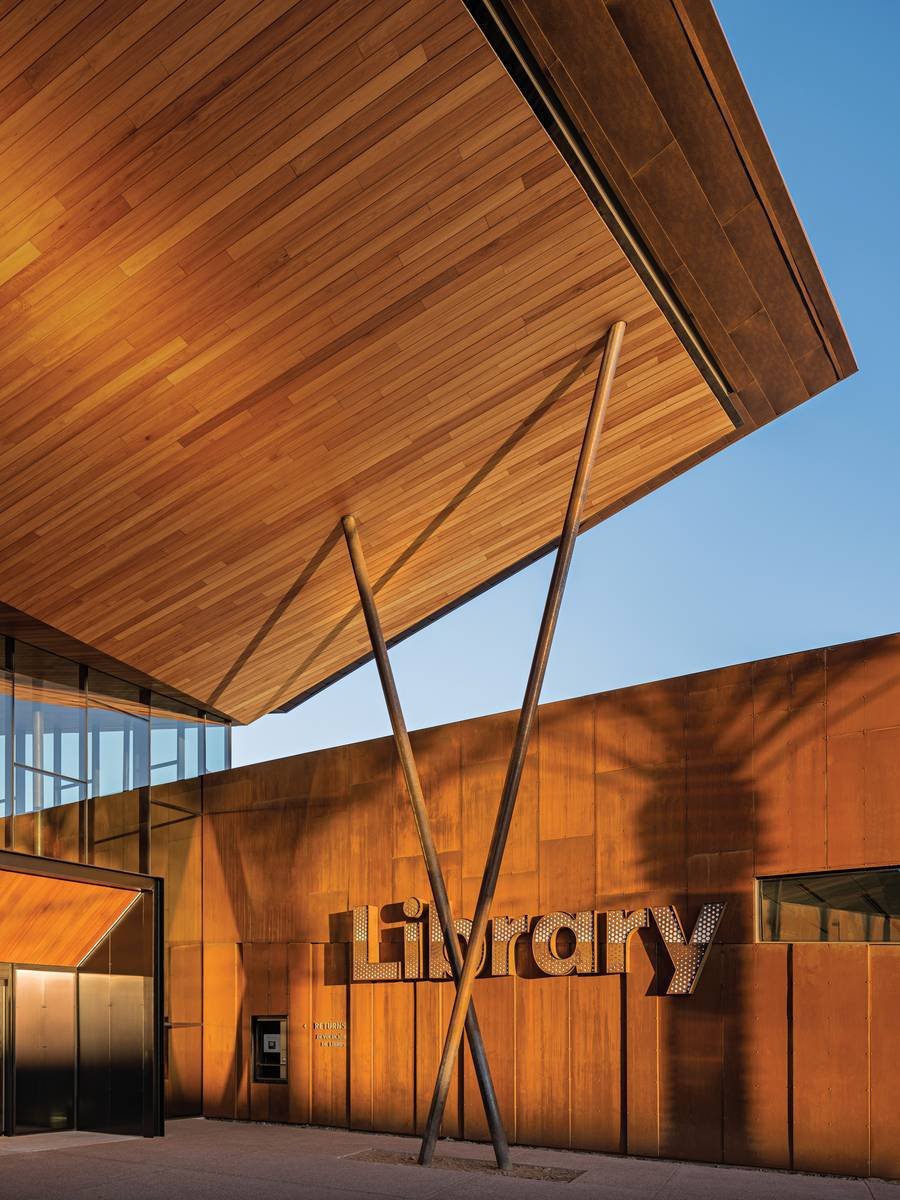 Timber-lined canopy and slender steel supports at Gateway Public Library; photograph © Jason Roehner