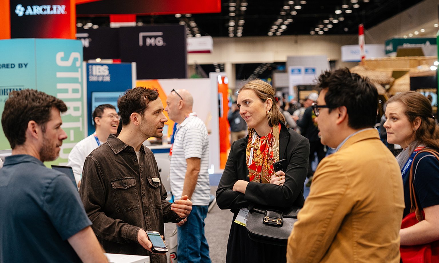 Attendees and exhibitors inside the NAHB International Builders’ Show exhibition hall