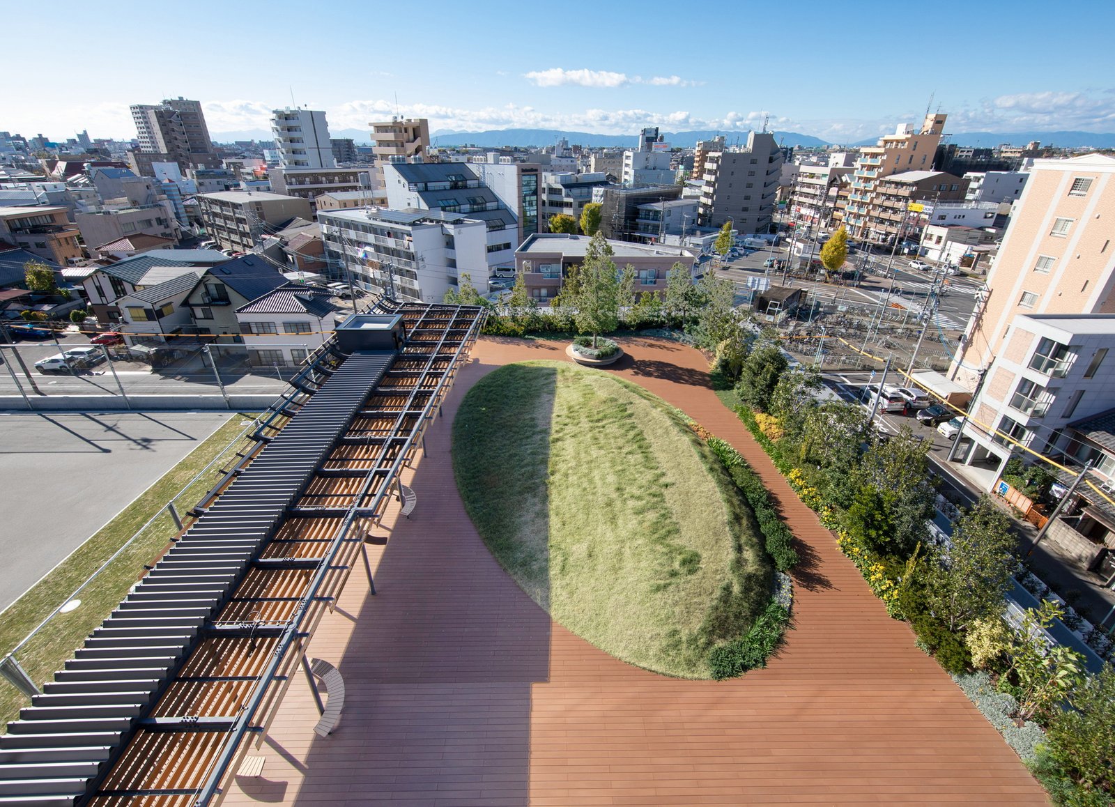 Planted elevated terrace beside a covered walkway