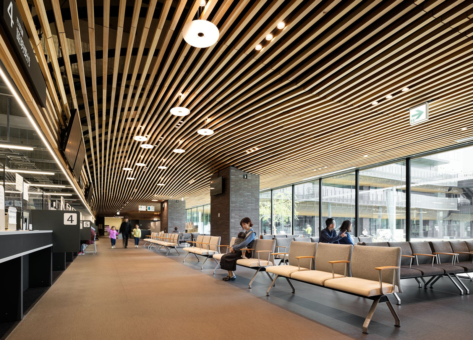 Waiting seats beneath a timber-lined ceiling