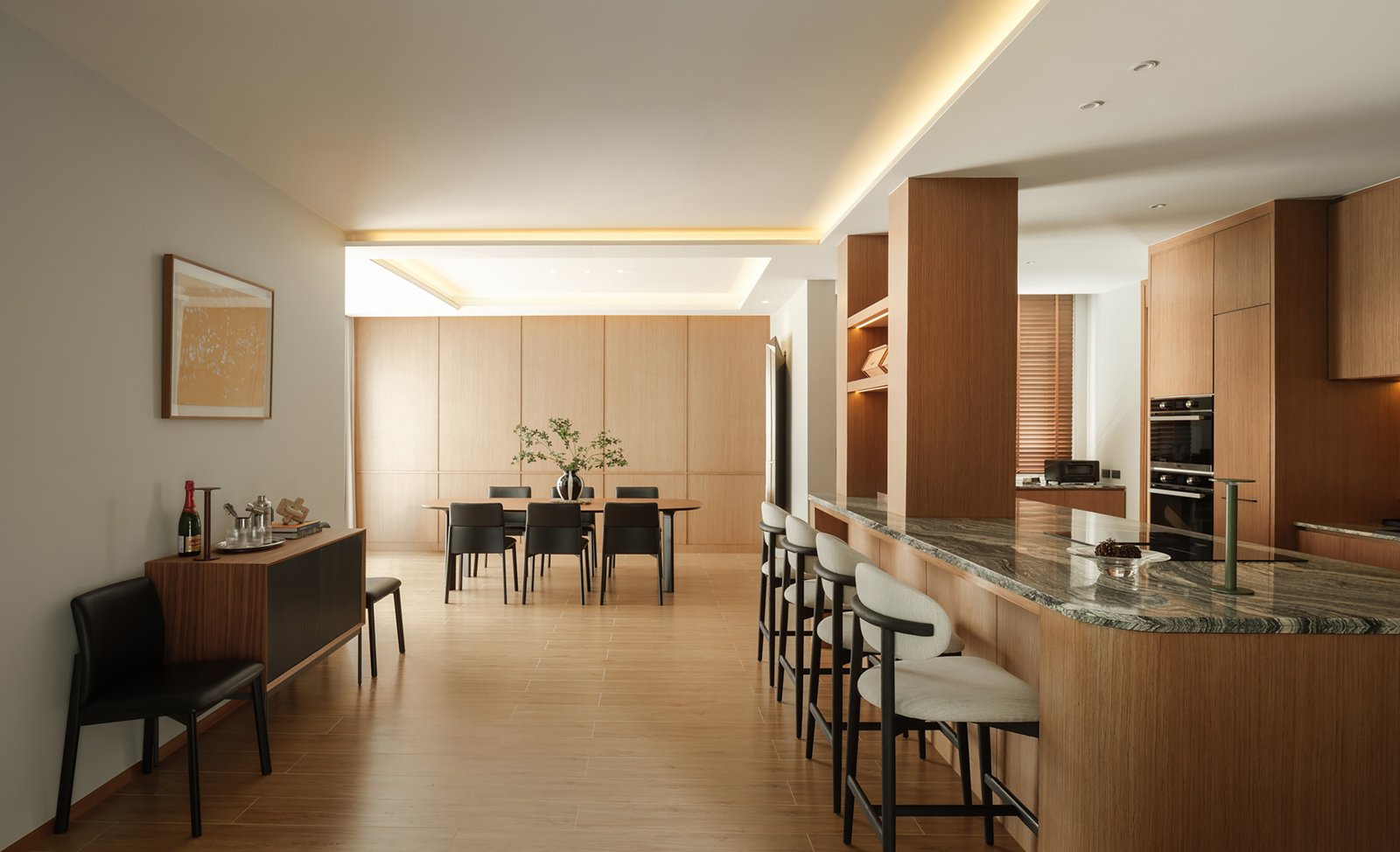 Dining table and kitchen within the renovated open interior