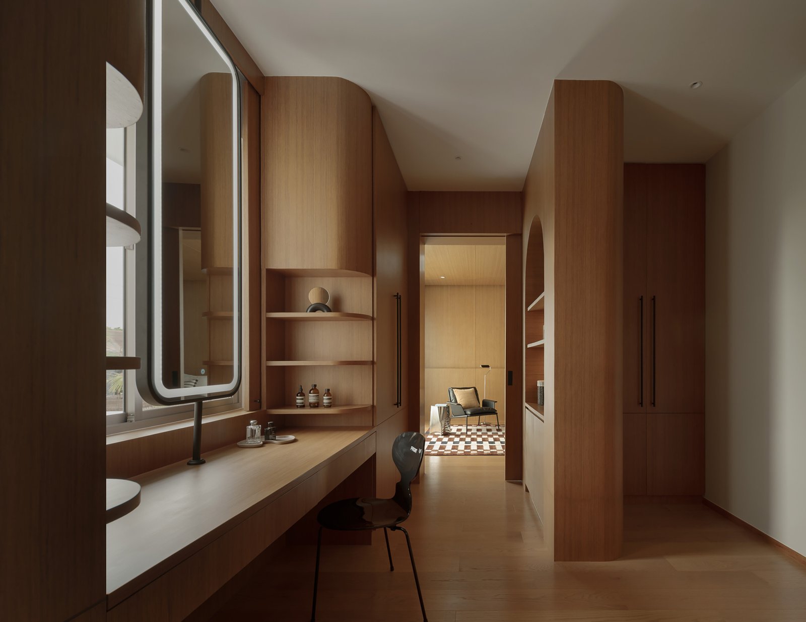 Timber cabinetry and glazed corridor in the private wing