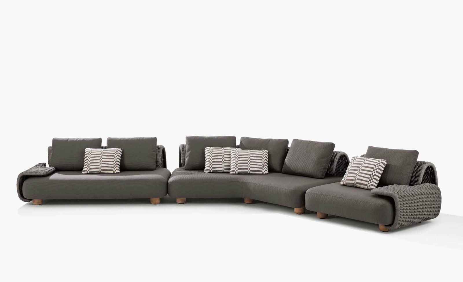 Shore outdoor sofa in a curved arrangement with woven outer arms