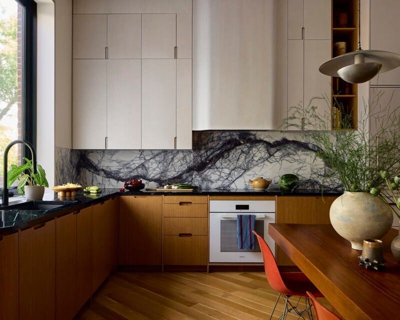 Perimeter cabinetry combines white oak, soapstone counters and lilac marble.