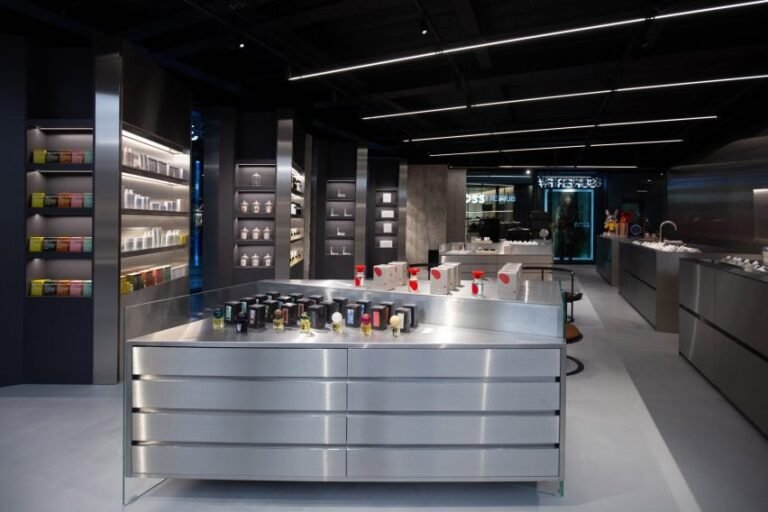Steel display island, shelving and black service ceiling inside the Super F store in Malta
